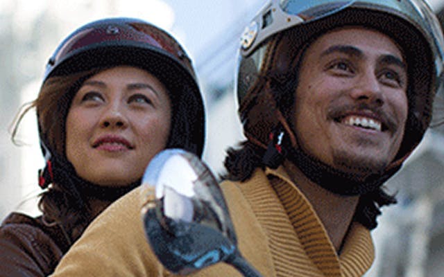 photo of man and woman on scooter
