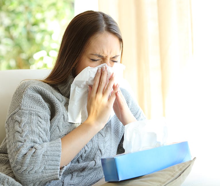 495917899 Man suffering nasal congestion massages his sinuses