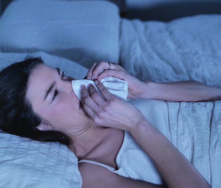 790652359 Man suffering nasal congestion massages his sinuses