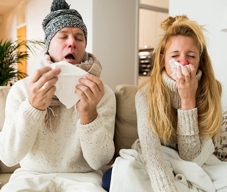 511842424 Man suffering nasal congestion massages his sinuses