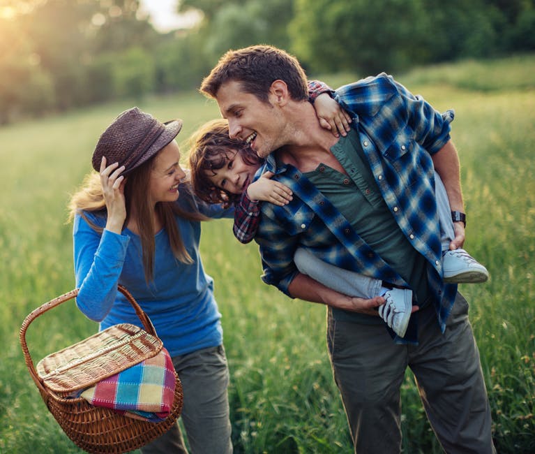 Family walking in a field where Otrivin can help with baby cold remedies.