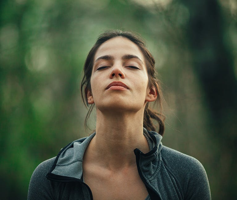 The long-haired woman looked up and breathed in the fresh air