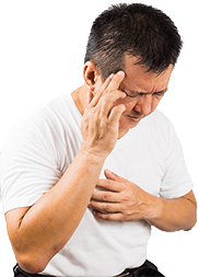 Man holding his head due to migraine suffering