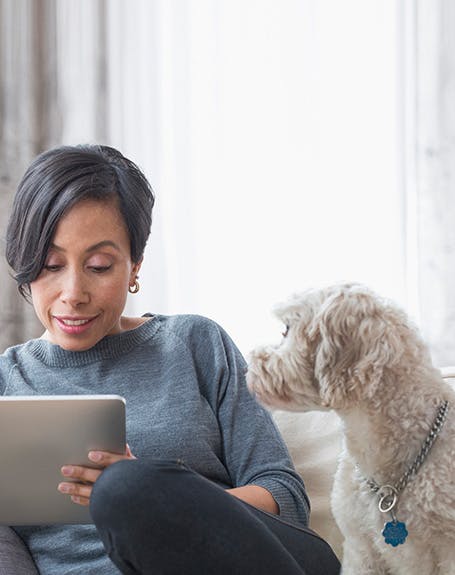 Woman with her dog reading