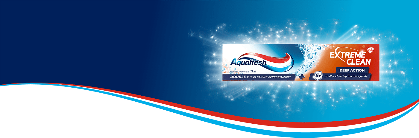 Captain Aquafresh holding Intense Clean Deep Action toothpaste and smiling.