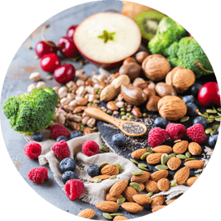 Pile of high fiber foods like fruits, nuts and vegetables