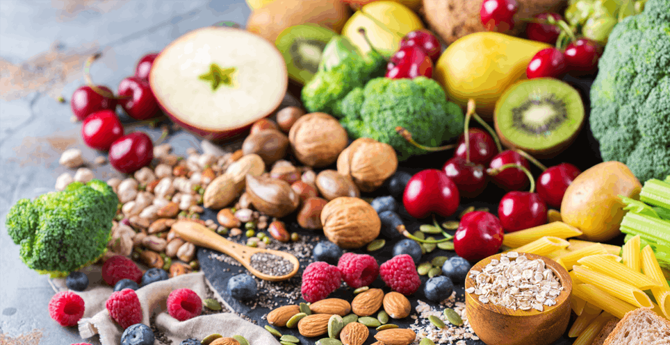 Pile of high fiber foods like fruits, nuts and vegetables