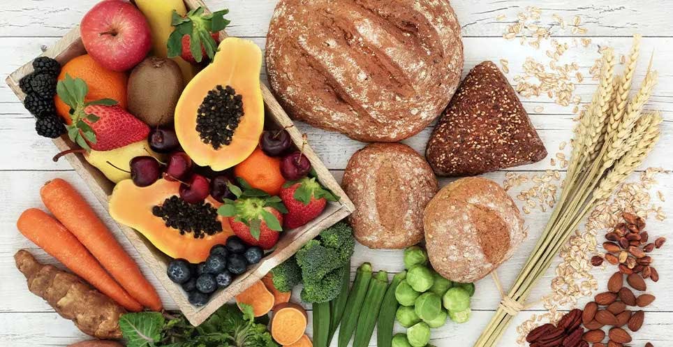 High-fiber foods spread out on a table High-fiber foods spread out on a table