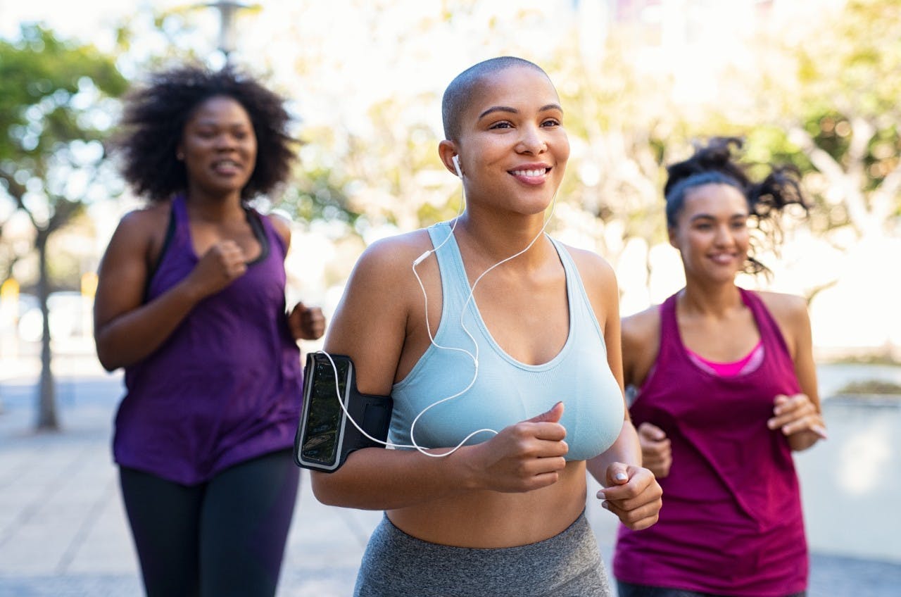 Group of three healthy women jogging