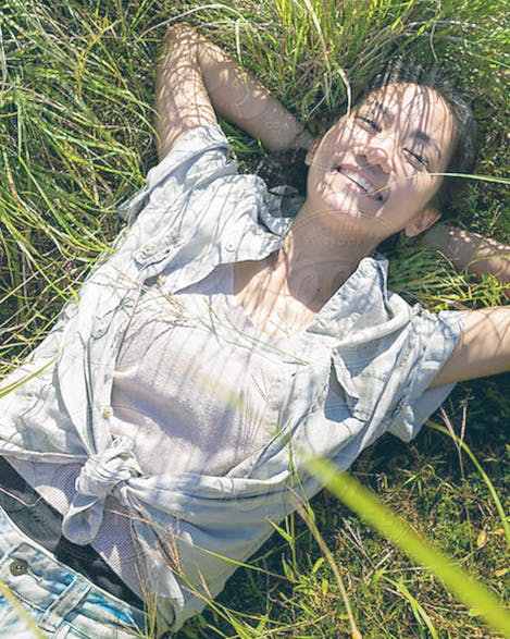 Woman Laying in Grass