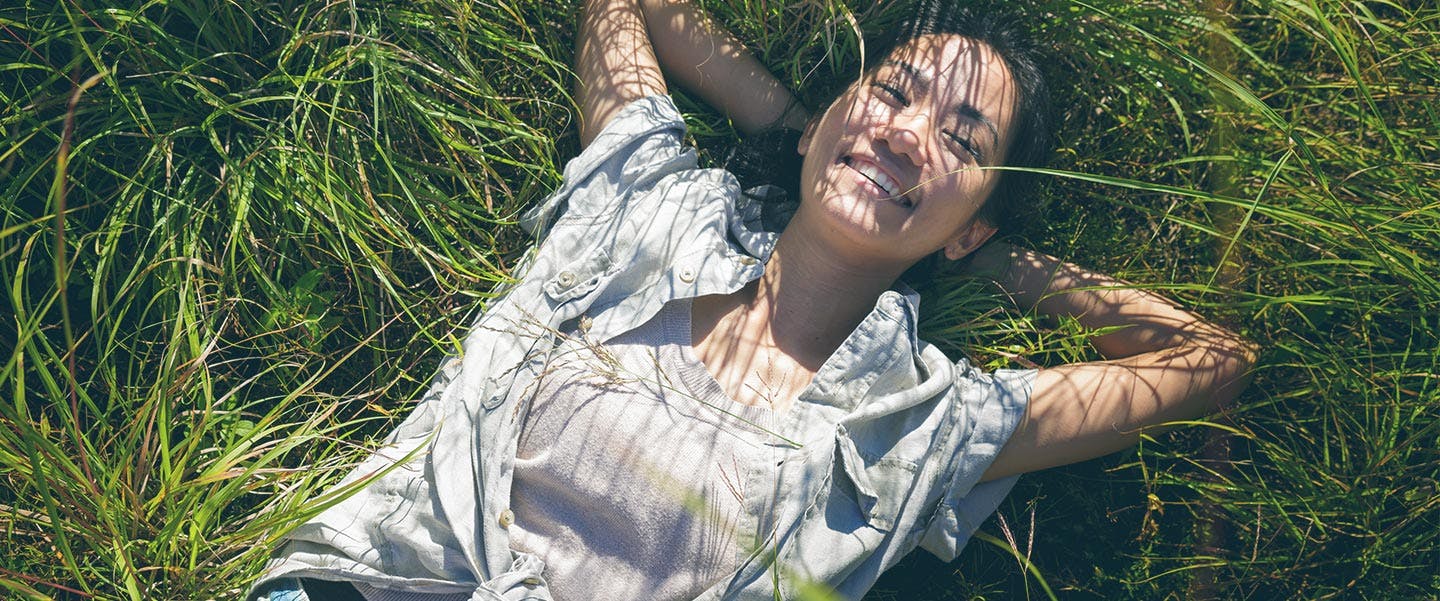Woman Laying in Grass