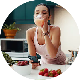 Woman making smoothie with prebiotics and probiotics for digestive gut health