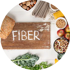 Foods high in fiber on a white background, including bread, chia seeds, nuts, beans, broccoli, apples, and greens.