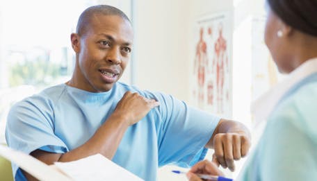 doctor talking to patient