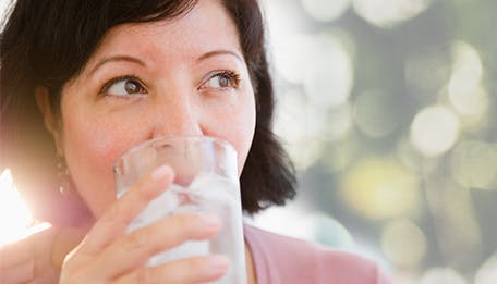 woman drinking ice cold water