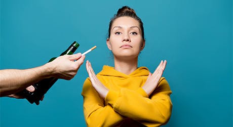 Woman refusing to drink or smoke