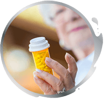 Woman holding bottle full of pills