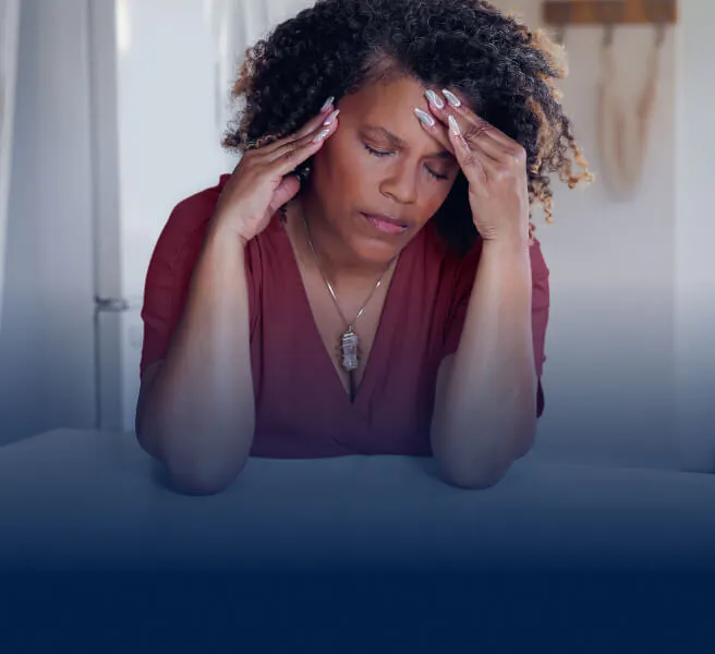 Woman holding her head in pain
