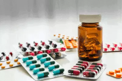 Jar and packets of medicine tablets and pills