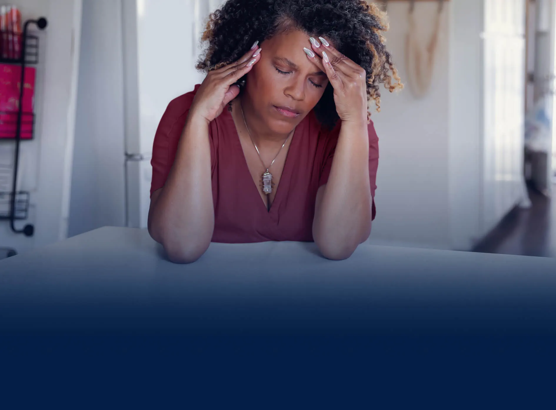 Woman holding her head in pain