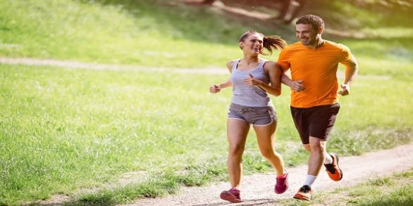 Happy couple running outdoors