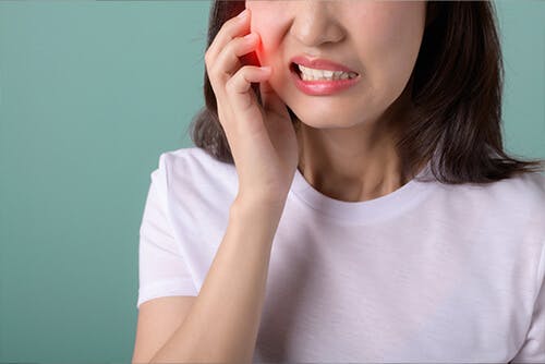 Woman with tooth pain needs a NSAID for tooth pain relief