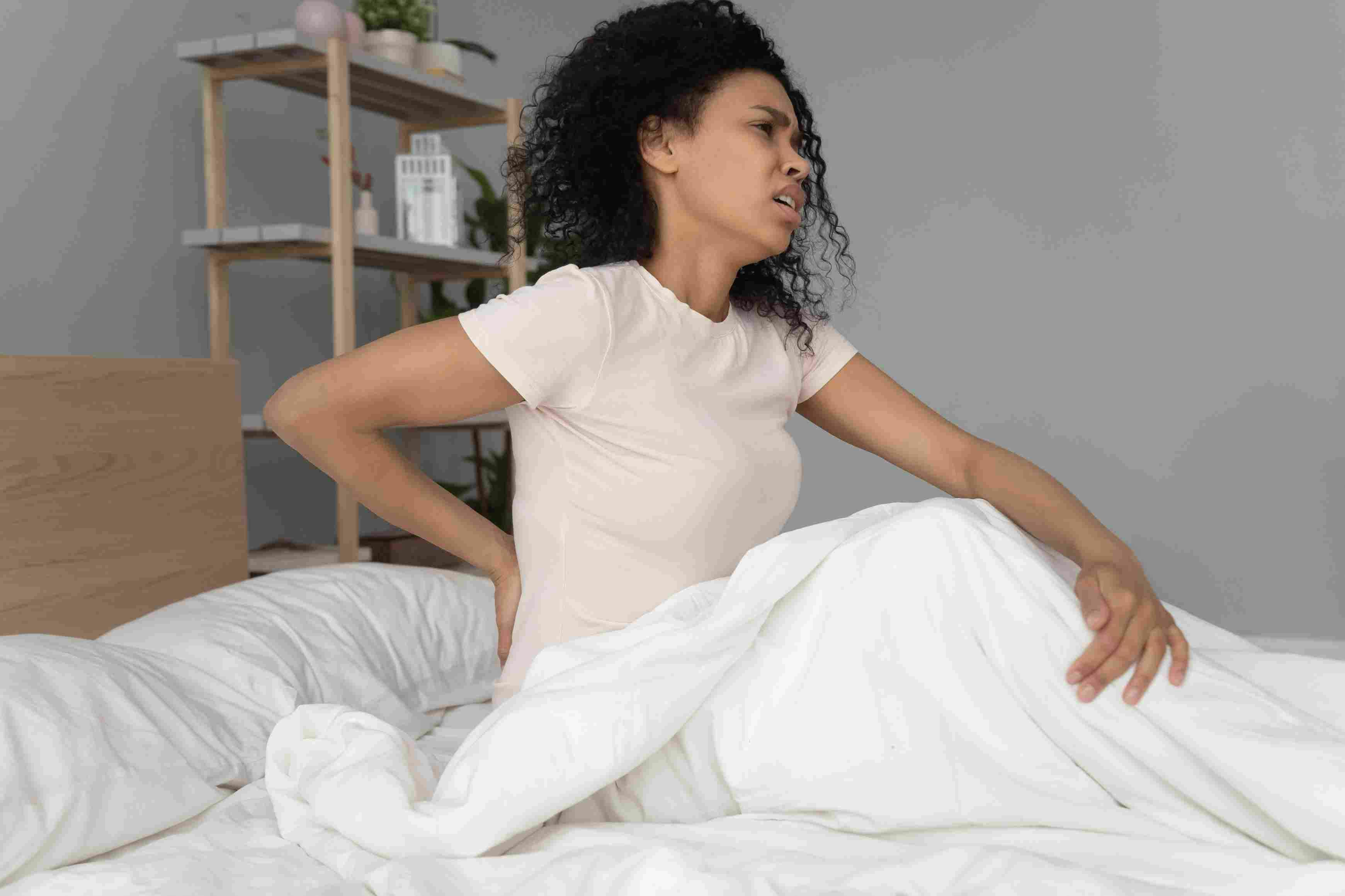 woman wakes up with sore back