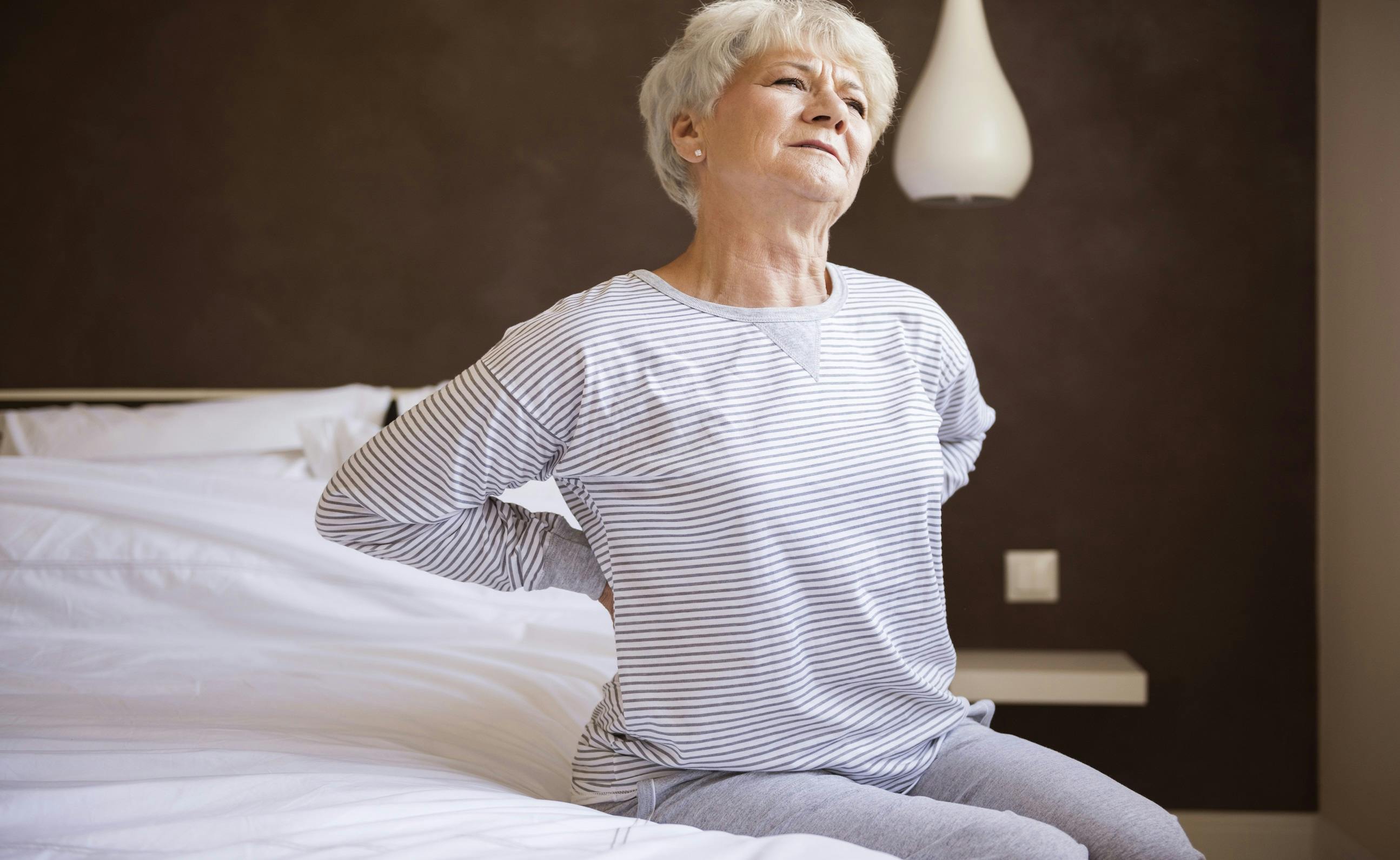 Concerned woman with back pain