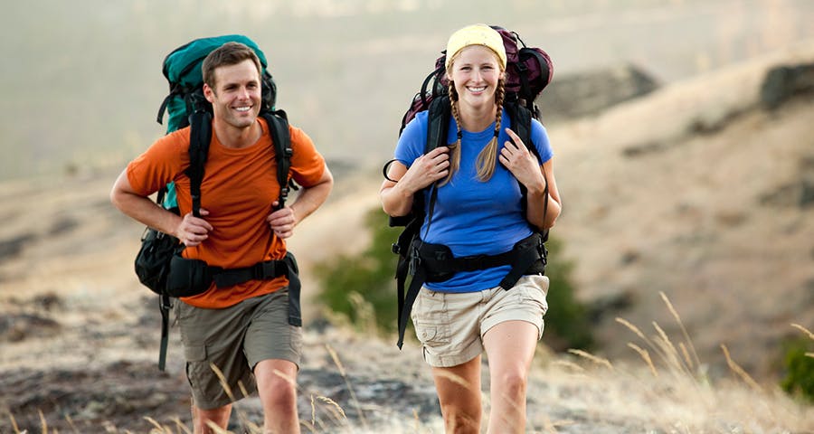 smiling couple hiking