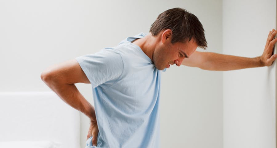 Young man have Lower back pain