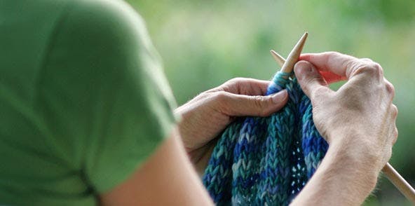 woman doing knitting work