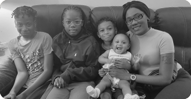 Candid photo of Deidra and her family on couch