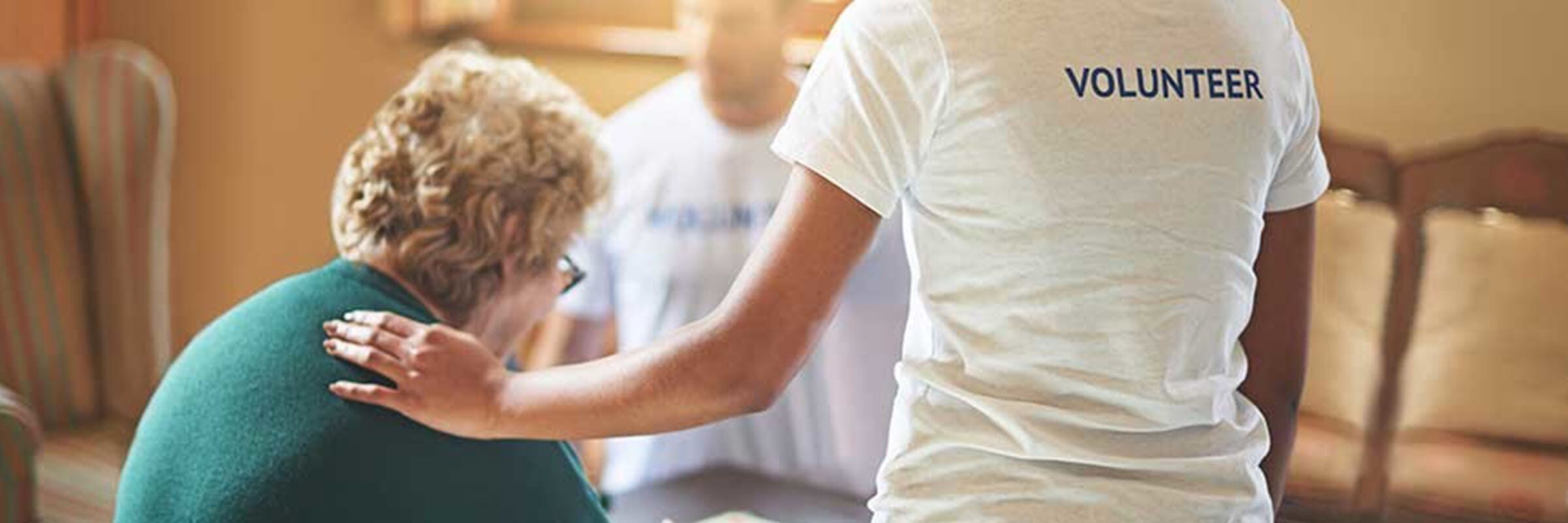 volunteers interact with senior