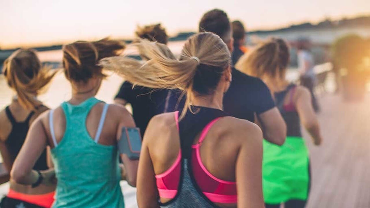group of people jogging together