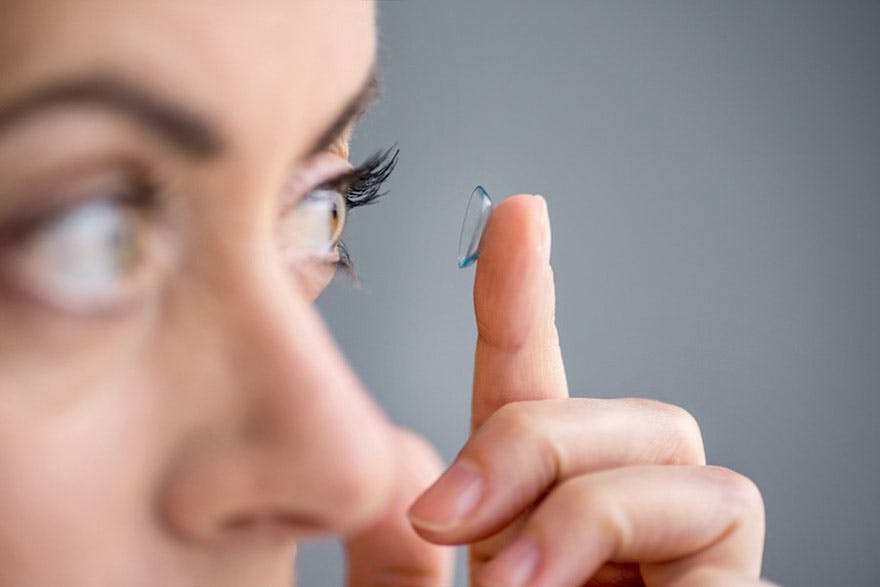 Lady putting contact lens thumbnail