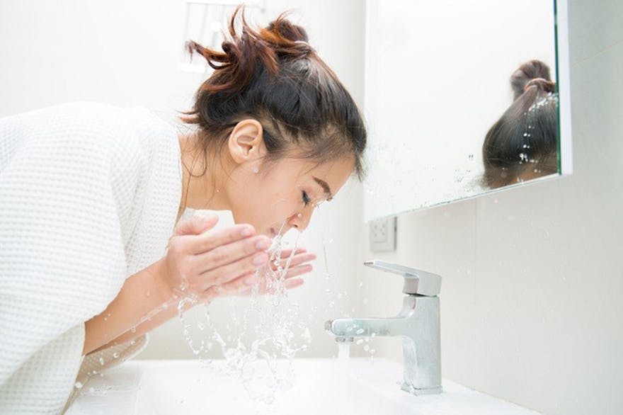 lady-washing-her-face