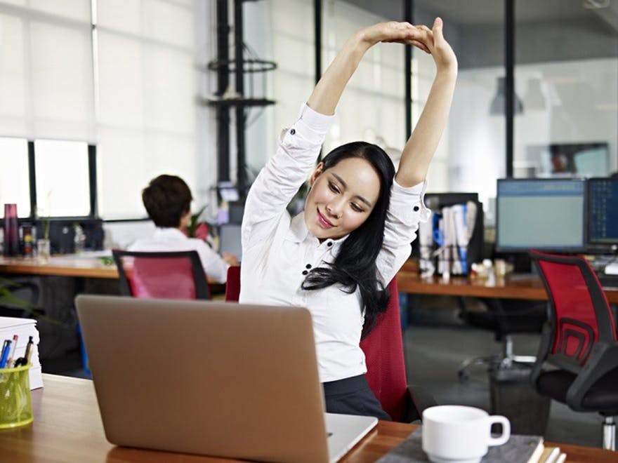 Lady_stretching_in_office