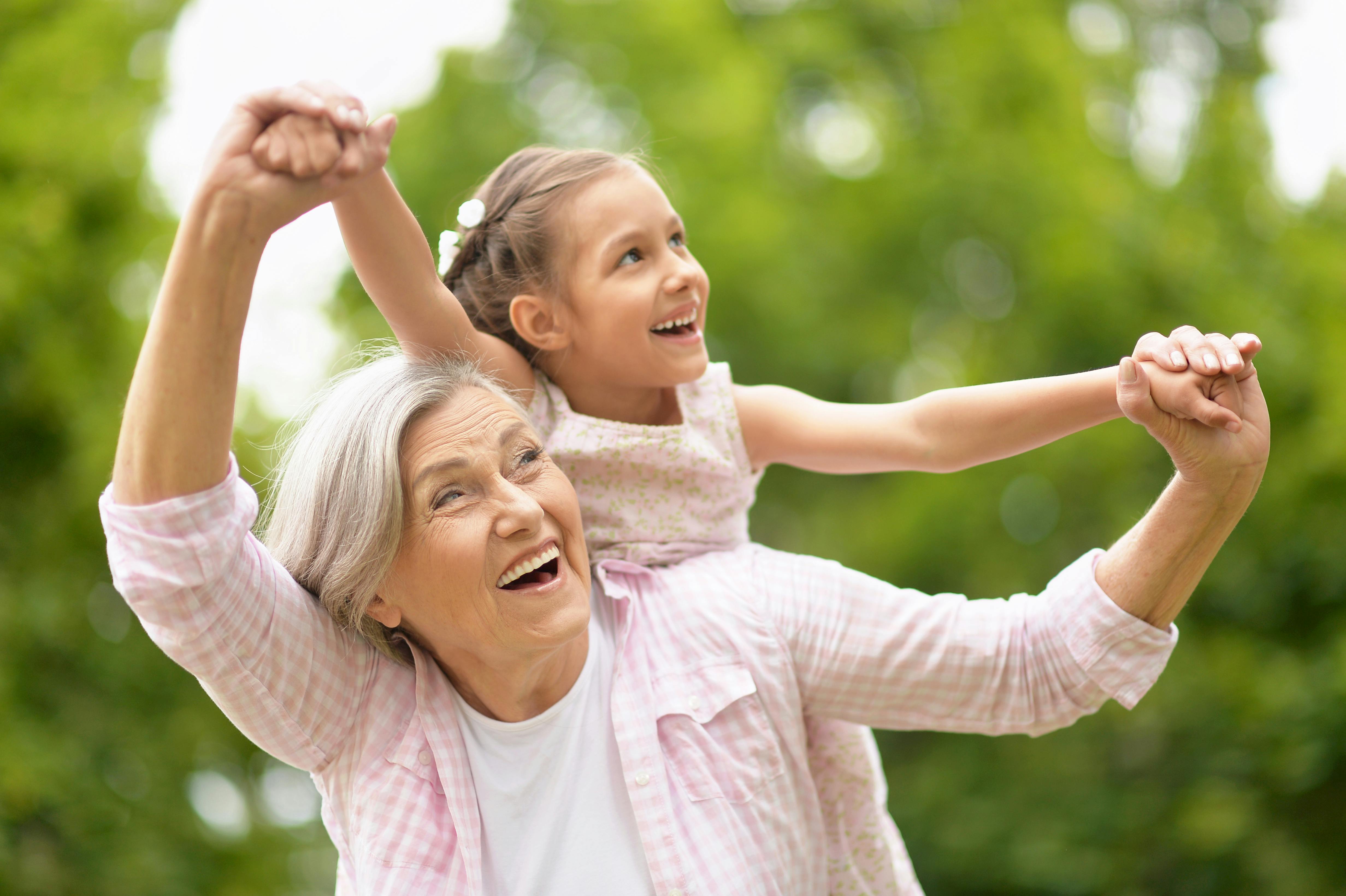 Older woman outside with child