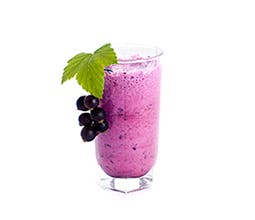 Ah-Sigh-Ee Fruit Smoothie in glass with purple berries and garnish 