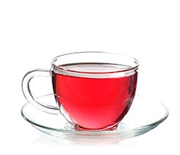 Hot Tea Pink Edition drink in clear teacup