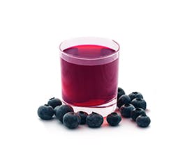 Sparking Blueberry-Ginger Lemonade in glass with fresh blueberry 