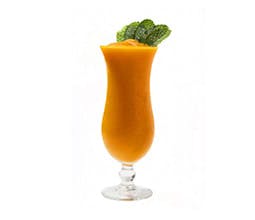 Super Orange Smoothie in a tall glass with mint garnish