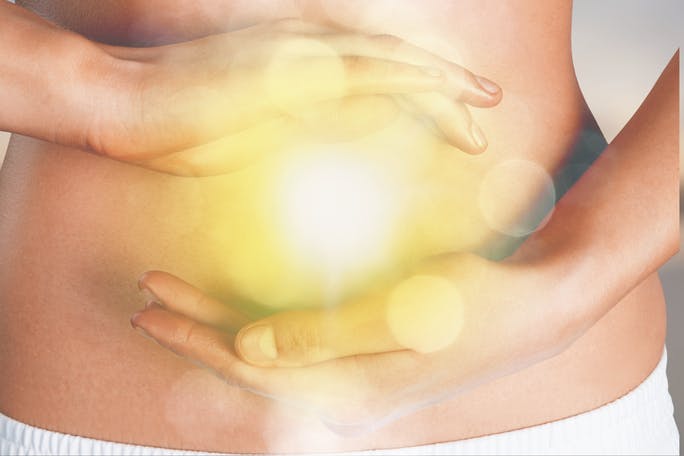 Woman’s hands showing balance of microbiota in her gut