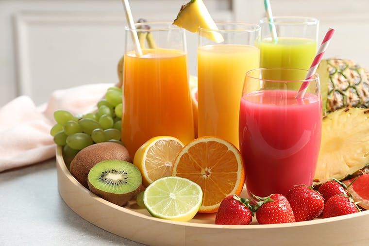 a platter of fruit and drinks