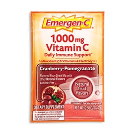 Box of Emergen-C Everyday Immune Support in Cranberry Pomegranate flavor with packet and water glass