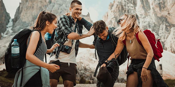 People laughing as they hike in the mountains