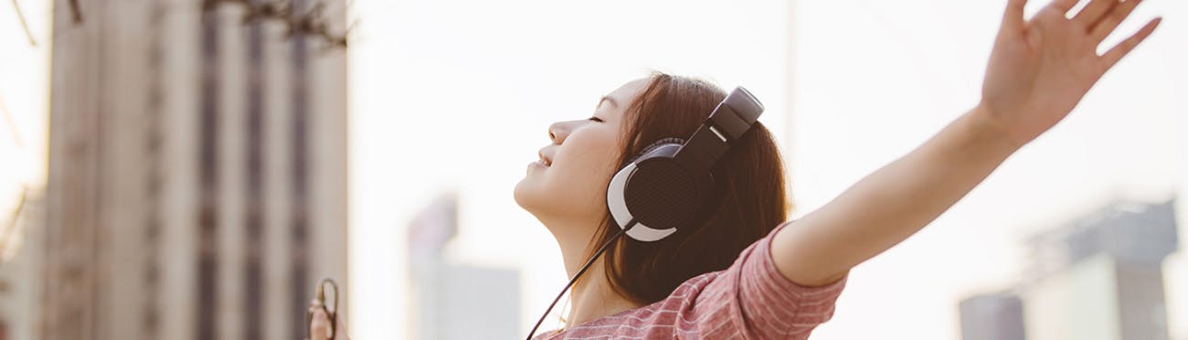 Woman Listening to Music Outside