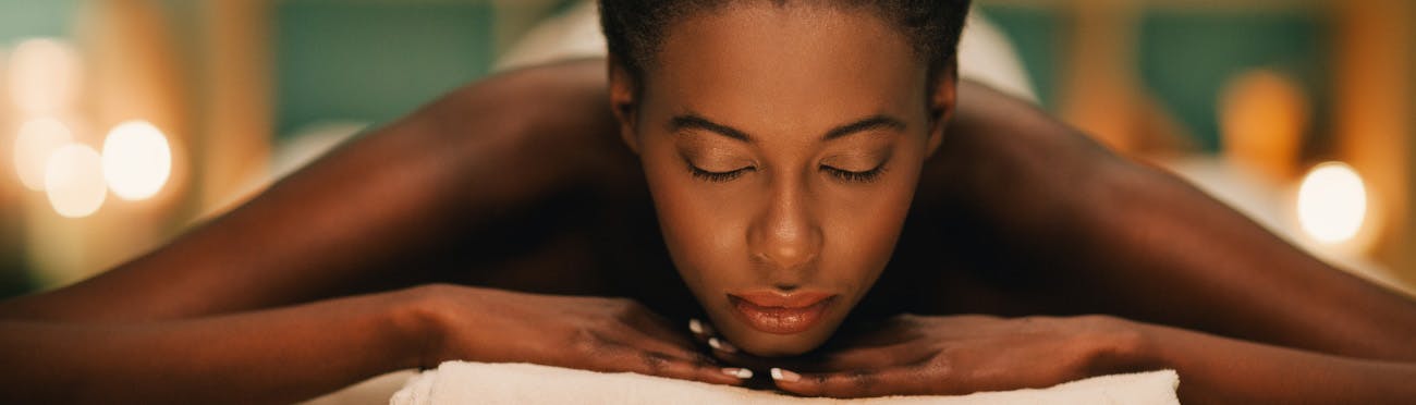 Woman getting a massage to relieve headache pain