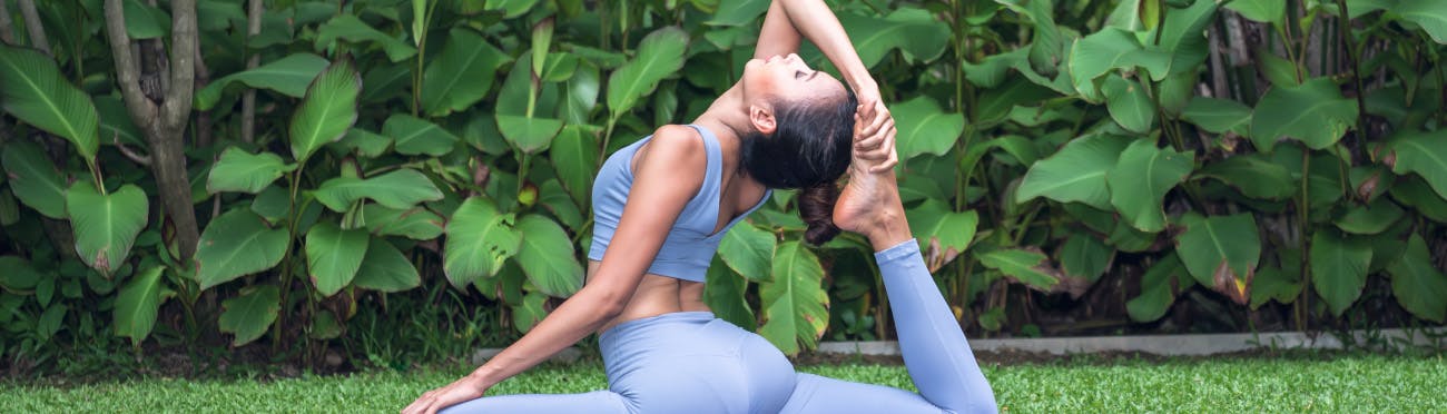 forward fold yoga pose outdoors