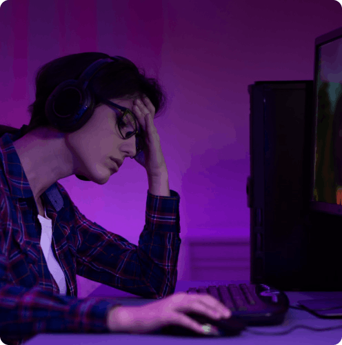 Woman playing video games experiences headache